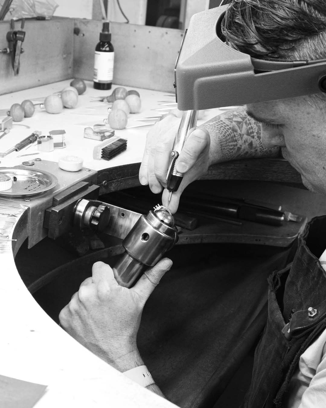 Preparing the setting. First, Simon prepares the shoulder setting, creating an indent for the small diamonds to sit snugly between the beads.