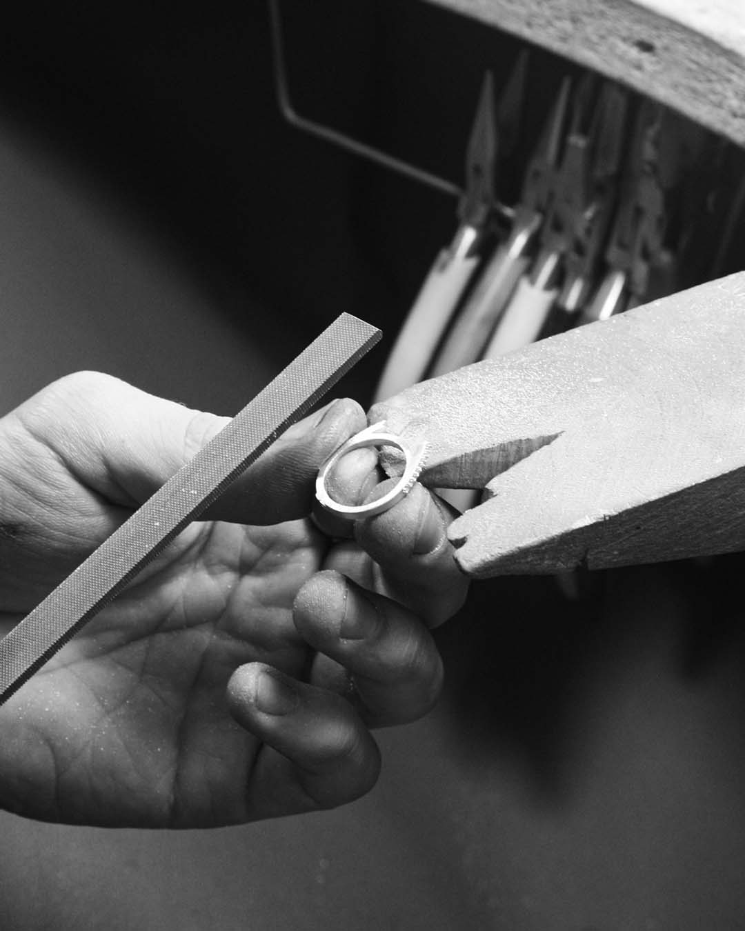 Filing the band. He then moves on to tidying up the band to prepare it for soldering.