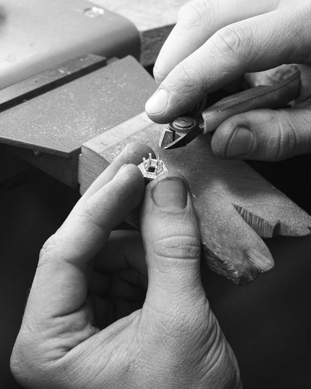 Clipping claws. Before soldering the setting to the band, Lukas finishes off the setting by clipping the claws to a uniform length.