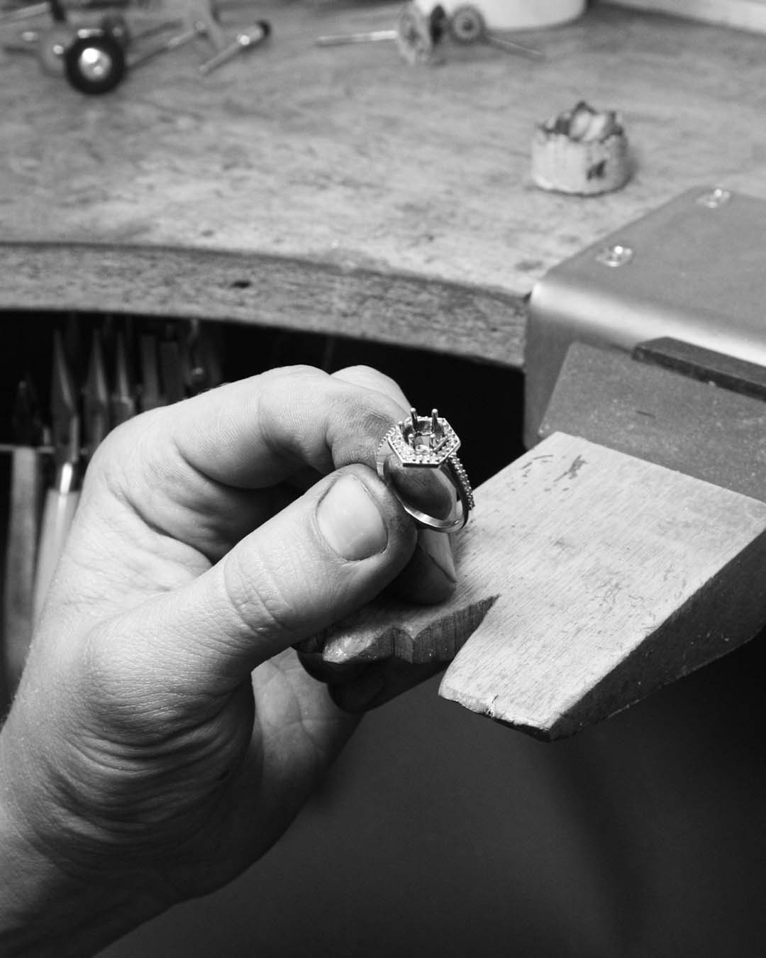 After soldering the setting to the band, Lukas does a final polish before passing the Hex Engagement Ring on to our in-house Stone Setter, Simon for diamond setting.