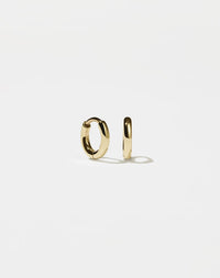 A pair of small, gold-plated hoop earrings with a central hinge, designed to fit close to the earlobe.