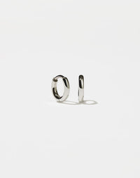 A pair of sterling silver hoop earrings with a central hinge, designed to fit close to the earlobe.