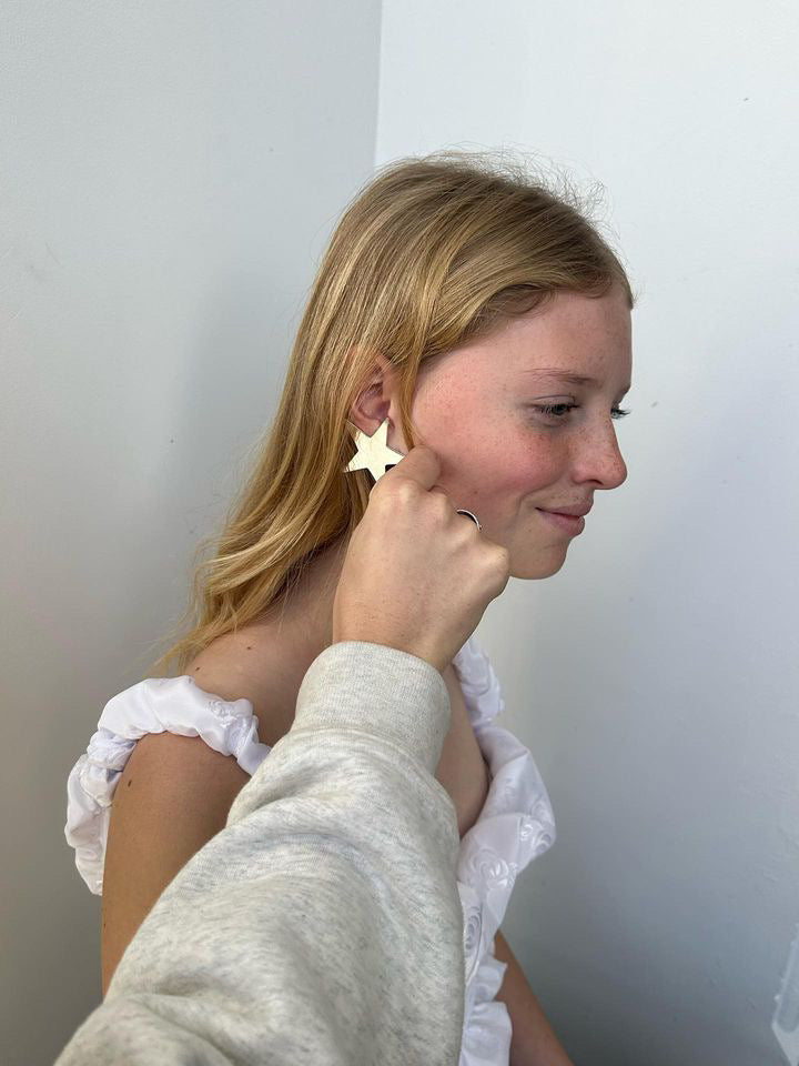 Model, Isla wearing the Big Star Earrings.