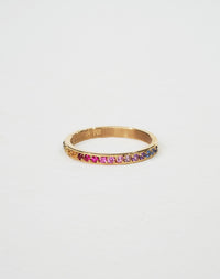 A 9ct yellow gold eternity band ring pave set halfway with colorful rainbow sapphires.