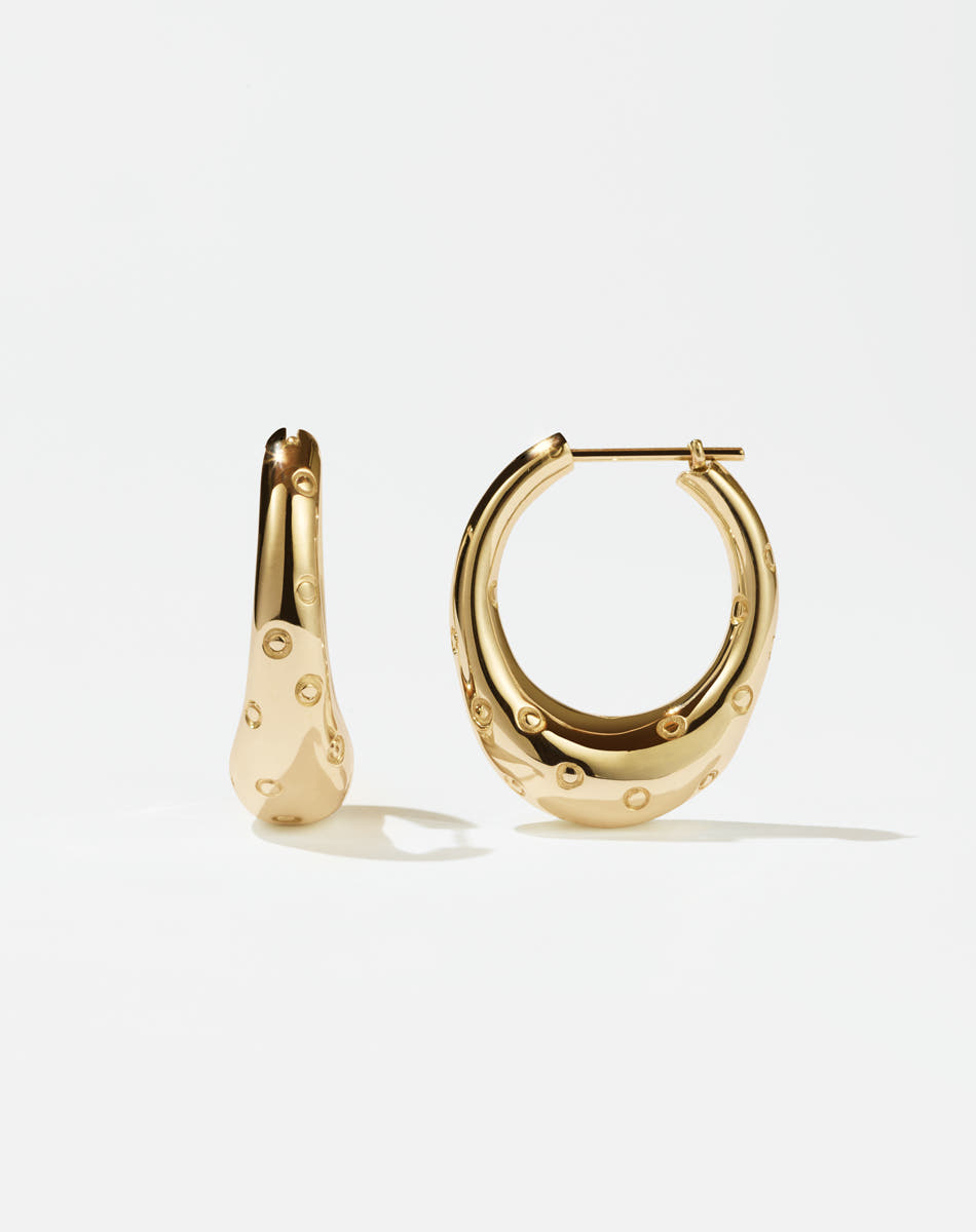 A pair of large hoop earrings made of gold, designed to resemble strawberries.
