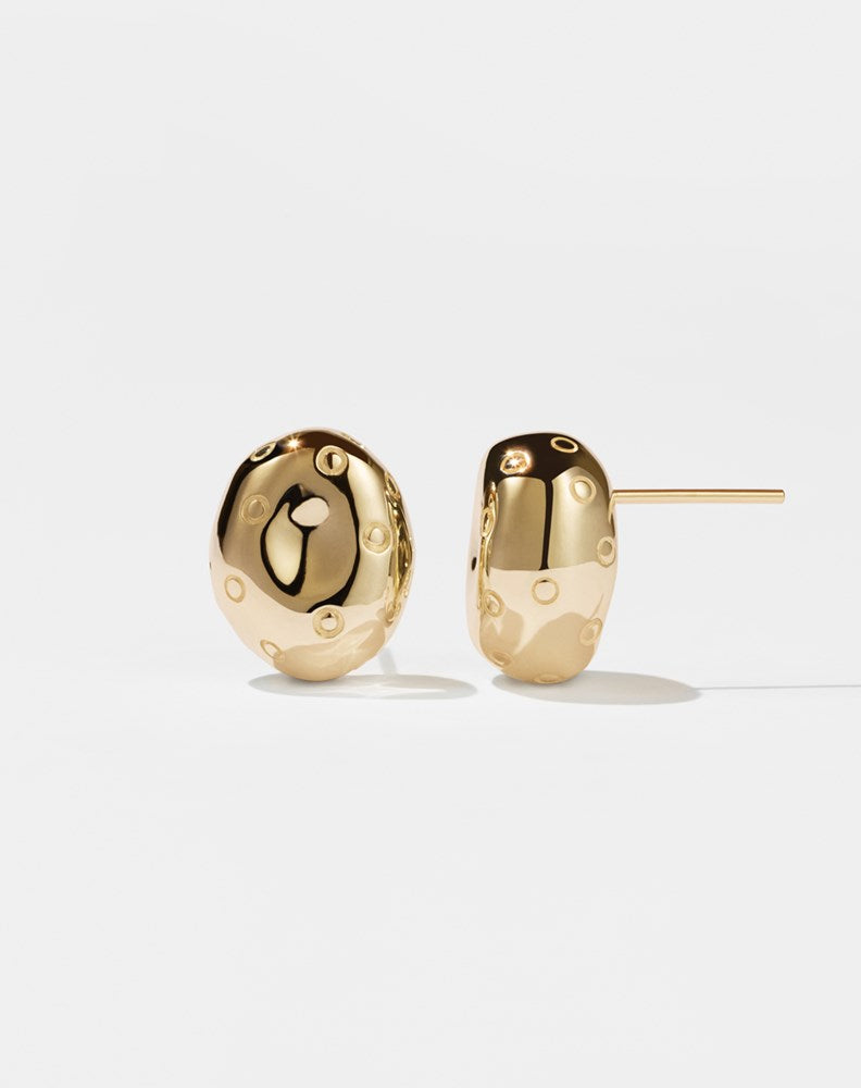 A pair of small, gold-plated earrings designed in the shape of abstract strawberries with seeds