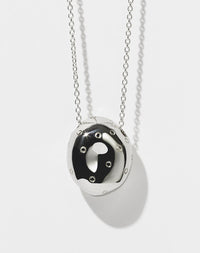 A sterling silver pendant in the shape of an abstract strawberry 