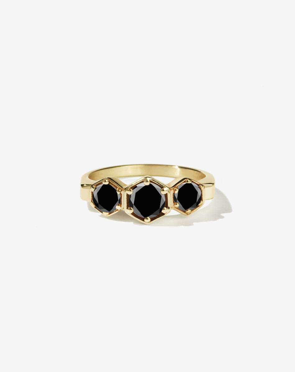 Meadowlark Jewellery’s classic 3 Hexagon Stone Engagement Ring in 18ct Yellow Gold, claw set with 0.95ct round brilliant cut black diamonds. A bold and beloved 3 stone ring, this Ceremonial design is made to order in New Zealand.