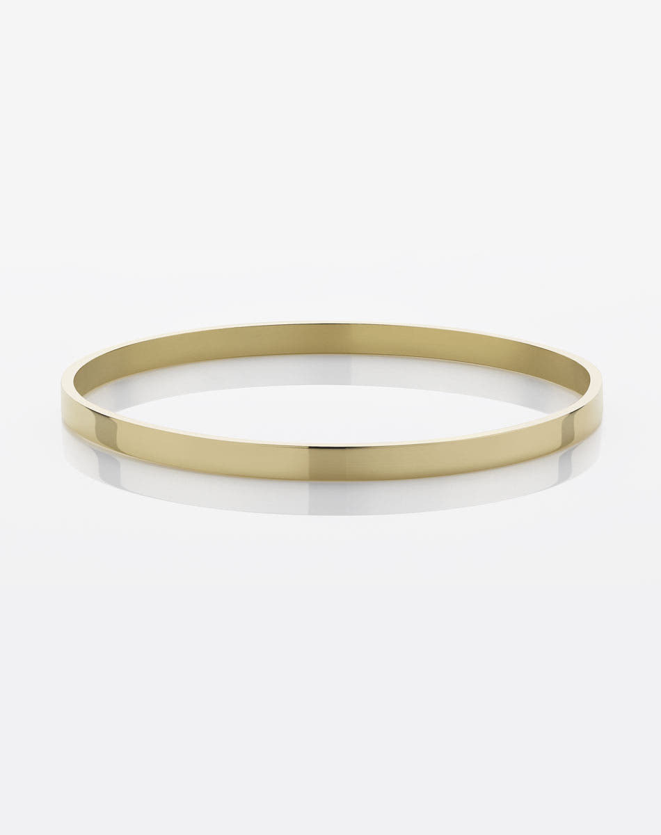 A solid 4mm wide smooth gold bangle bracelet.