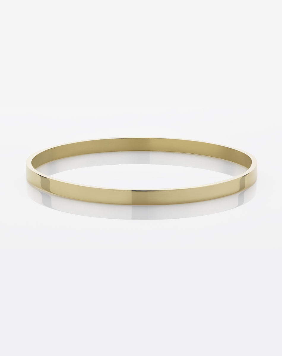A solid 4mm wide smooth gold bangle bracelet.