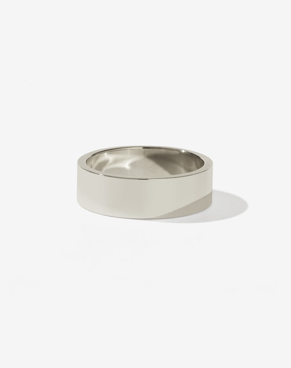 A simple, classic wide band men's wedding ring in 9ct white gold. 
