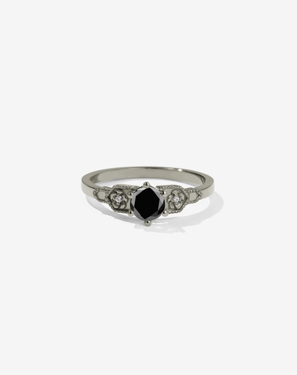 Meadowlark Jewellery’s vintage inspired 0.5ct Eternal Solitaire Engagement Ring in 14ct White Gold, claw set with a round brilliant cut black diamond centre stone. Atop a fine square band. A timeless, floral Ceremonial design made to order in New Zealand. Pair with the diamond pave set Eternal Wedding Band.