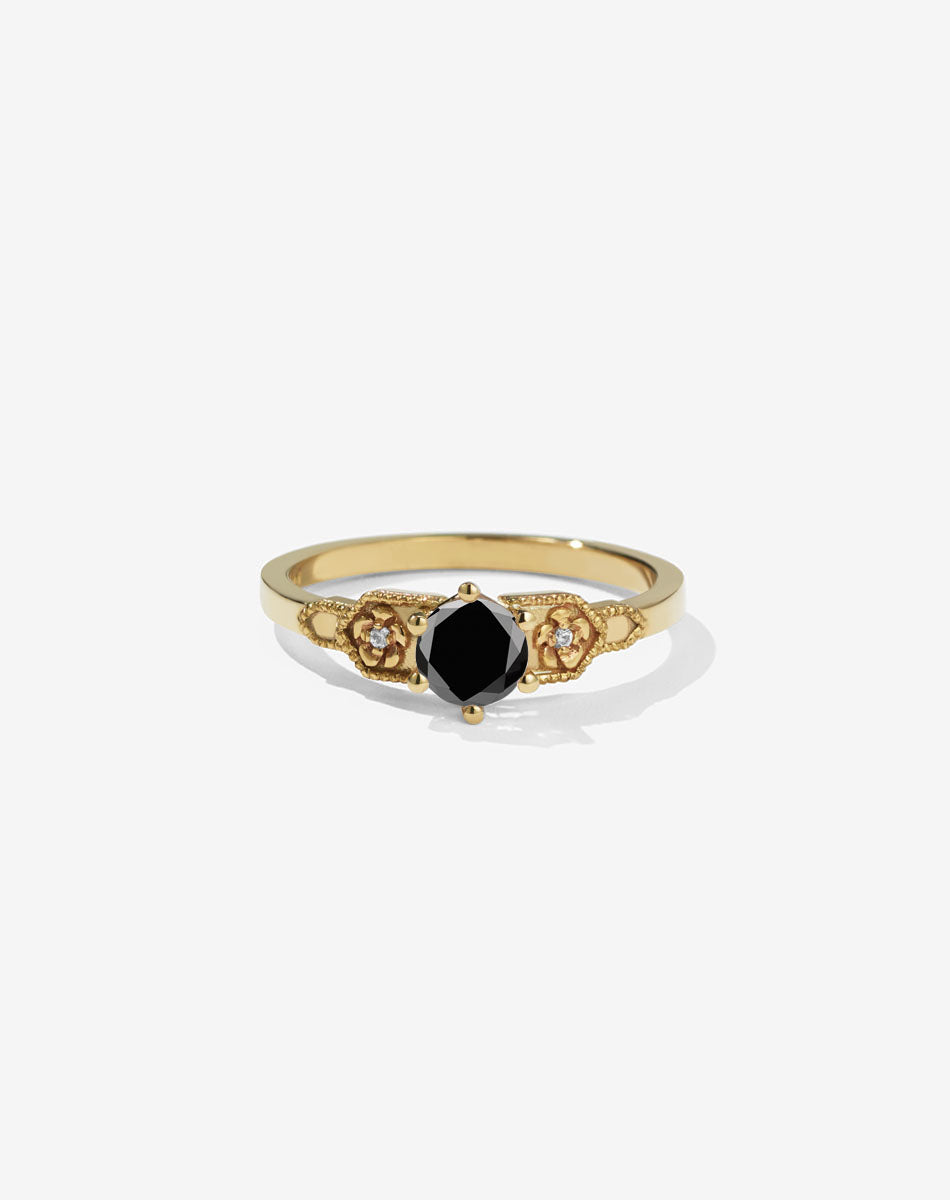 Meadowlark Jewellery’s vintage inspired 0.5ct Eternal Solitaire Engagement Ring in 18ct Yellow Gold, claw set with a round brilliant cut black diamond centre stone. Atop a fine square band. A timeless, floral Ceremonial design made to order in New Zealand. Pair with the diamond pave set Eternal Wedding Band.