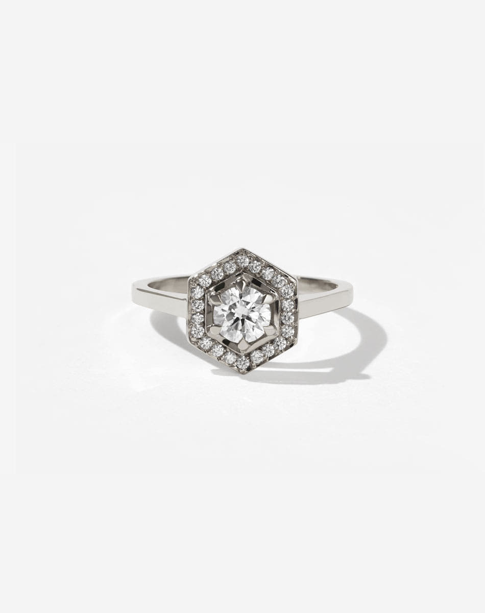 Meadowlark Jewellery’s iconic Hex Engagement Ring 0.5ct in 9ct White Gold, claw set with 0.61ct round brilliant cut white diamond centre stone, surrounded by a hexagon halo of pave set white diamonds. One of our most beloved and modern Ceremonial designs, made to order in New Zealand. Pair with our bestseller, the Diamond Eternity Band.