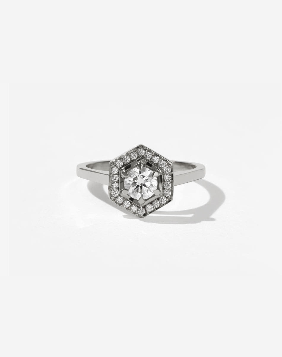 Meadowlark Jewellery’s iconic Hex Engagement Ring 0.5ct in Platinum, claw set with 0.61ct round brilliant cut white diamond centre stone, surrounded by a hexagon halo of pave set white diamonds. One of our most beloved and modern Ceremonial designs, made to order in New Zealand. Pair with our bestseller, the Diamond Eternity Band.