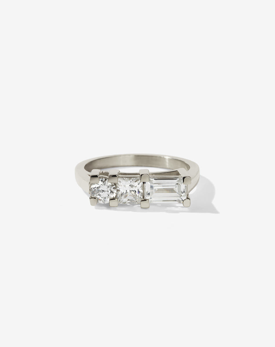 Meadowlark Jewellery’s architecture inspired 1.1ct Hilma Engagement Ring in 9ct White Gold, claw set with a round brilliant cut, princess cut and baguette cut white diamond. Atop a fine square band. A bold and alternative Ceremonial design made to order in New Zealand. Pair with our modern Stella Ring.