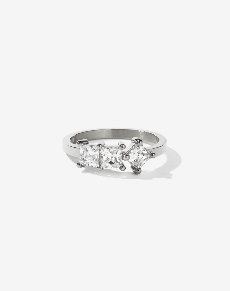 Meadowlark Jewellery’s modern 1.20ct Imogen Engagement Ring in Platinum, claw set with three princess cut white diamonds. Atop a fine square band. A graphic 3 stone engagement ring, inspired by art and architecture, this Ceremonial design is made to order in New Zealand.