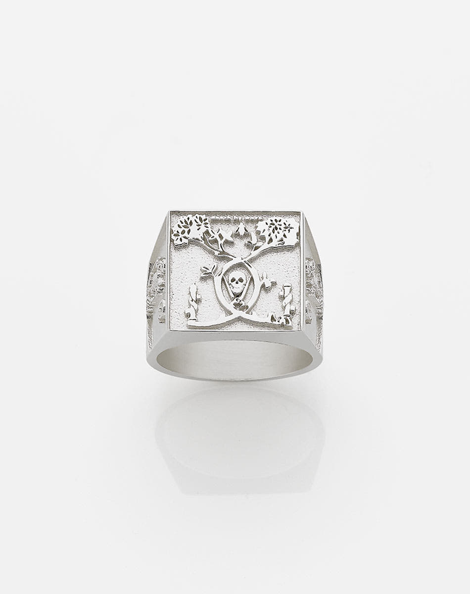A heavy weighted sterling silver ring with a collage of artworks, designed in collaboration with NZ artist Andrew McLeod.