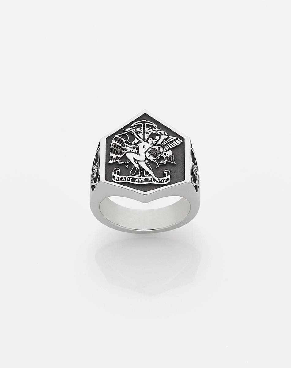 A heavy weighted sterling silver ring with a collage of artworks, designed in collaboration with NZ artist Andrew McLeod.