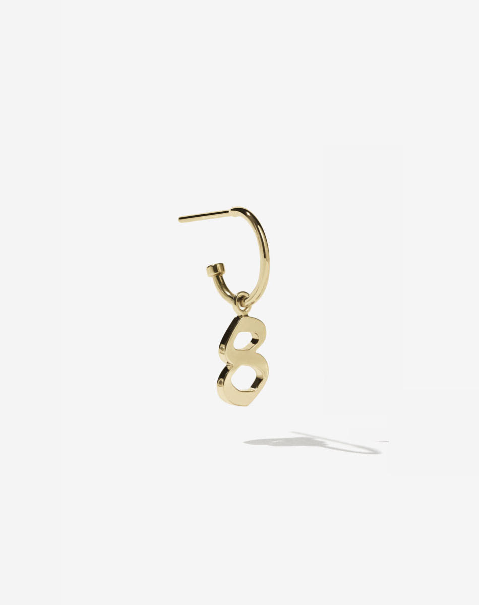 Gold plated Old English font charm on a singature hoop