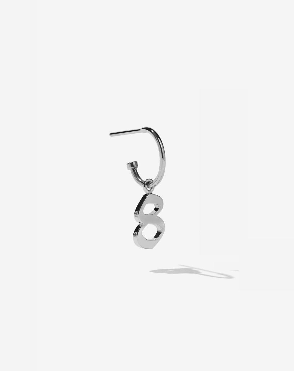 Silver charm Old English font charm on a singature hoops