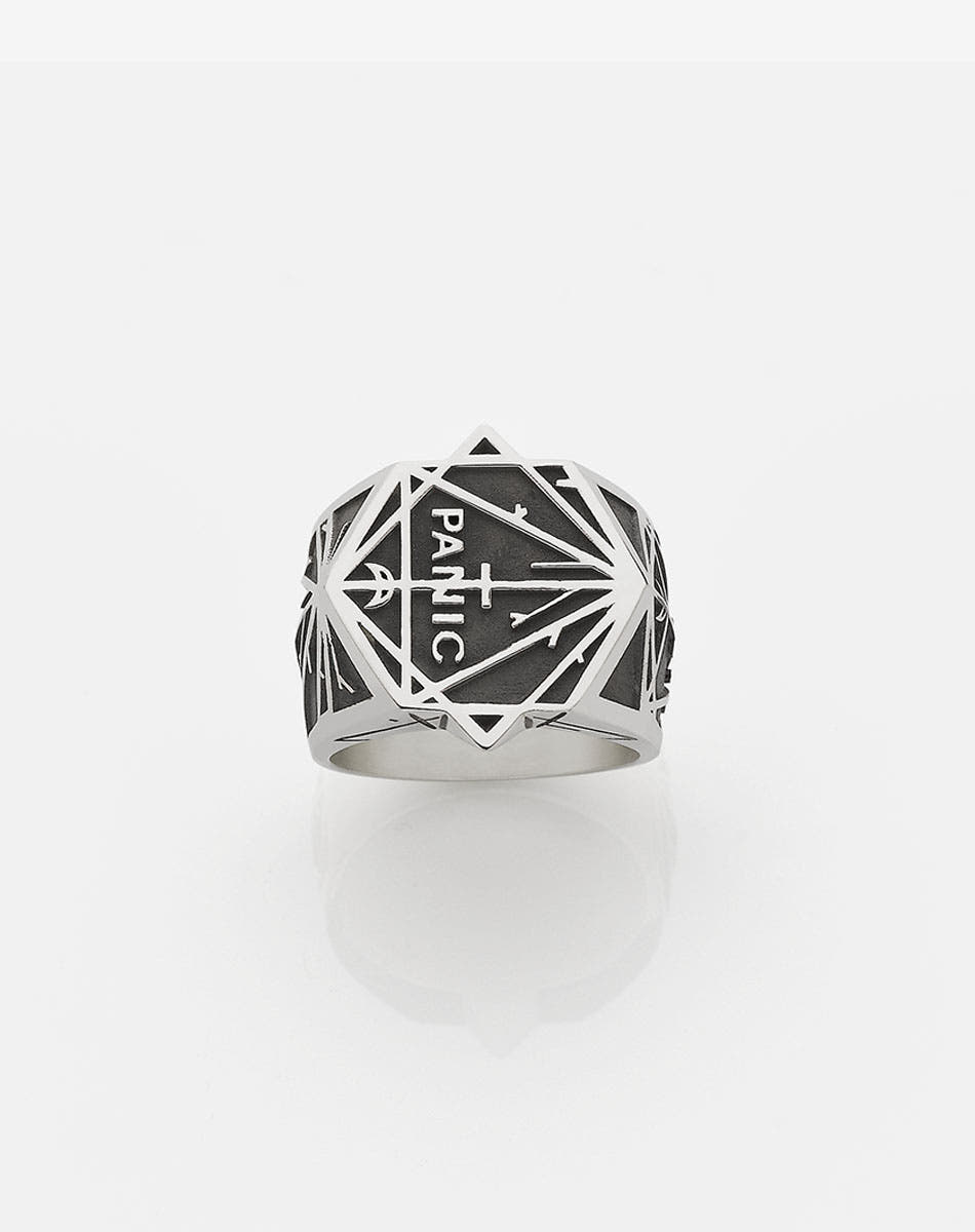 A heavy weighted sterling silver ring with a collage of black artworks designed by Andrew McLeod.