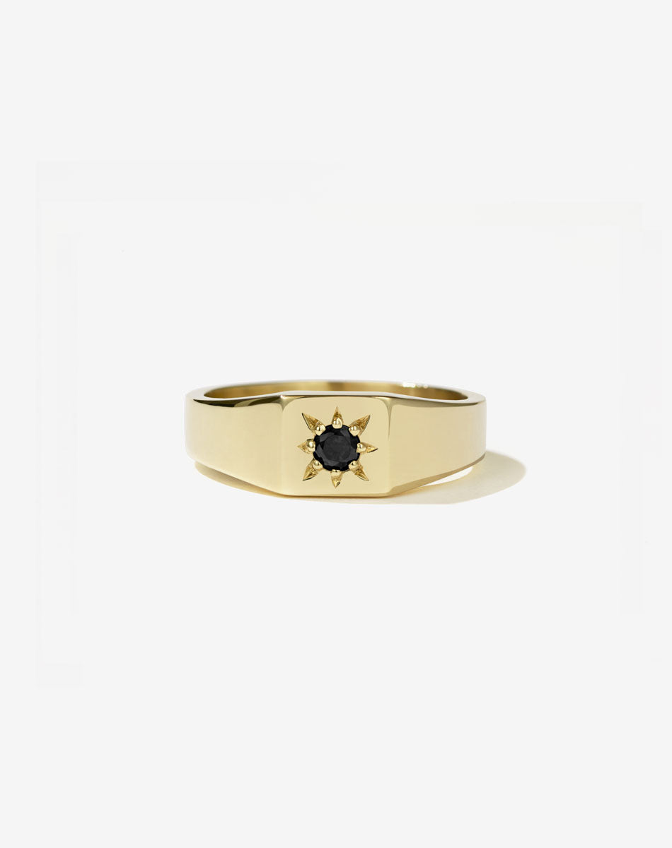 Meadowlark Jewellery’s vintage inspired 0.10ct Remy Signet Engagement Ring in 14ct Yellow Gold, star set with a round brilliant cut black diamond centre stone. Atop a fine square band. A modern Ceremonial design made to order in New Zealand.