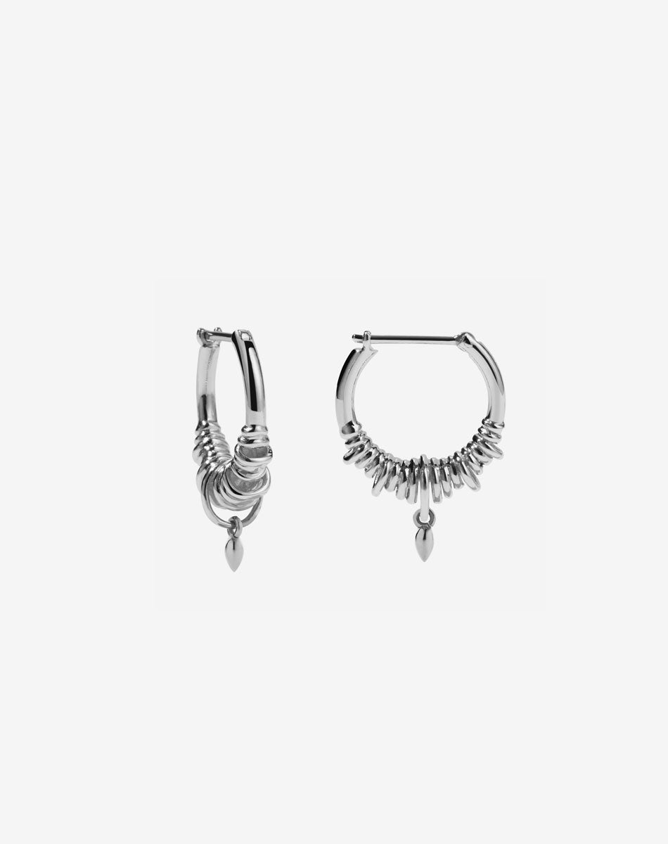 A pair of small hoop earrings made in sterling silver, with a series of rings suspended on a hoop, with small charm. 