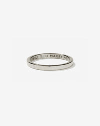 Meadowlark Jewellery’s 0.10ct Stand In Ring in 9ct White Gold, engraved with ‘will you marry me’ and swiss set with a round brilliant cut white diamond. A 2mm wide minimalist placeholder or proposal ring. This Ceremonial design can be worn as a wedding band and is made to order in New Zealand.