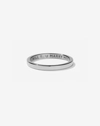 Meadowlark Jewellery’s 0.10ct Stand In Ring in Sterling Silver, engraved with ‘will you marry me’ and swiss set with a round brilliant cut white diamond. A 2mm wide minimalist placeholder or proposal ring. This Ceremonial design can be worn as a wedding band and is made to order in New Zealand.
