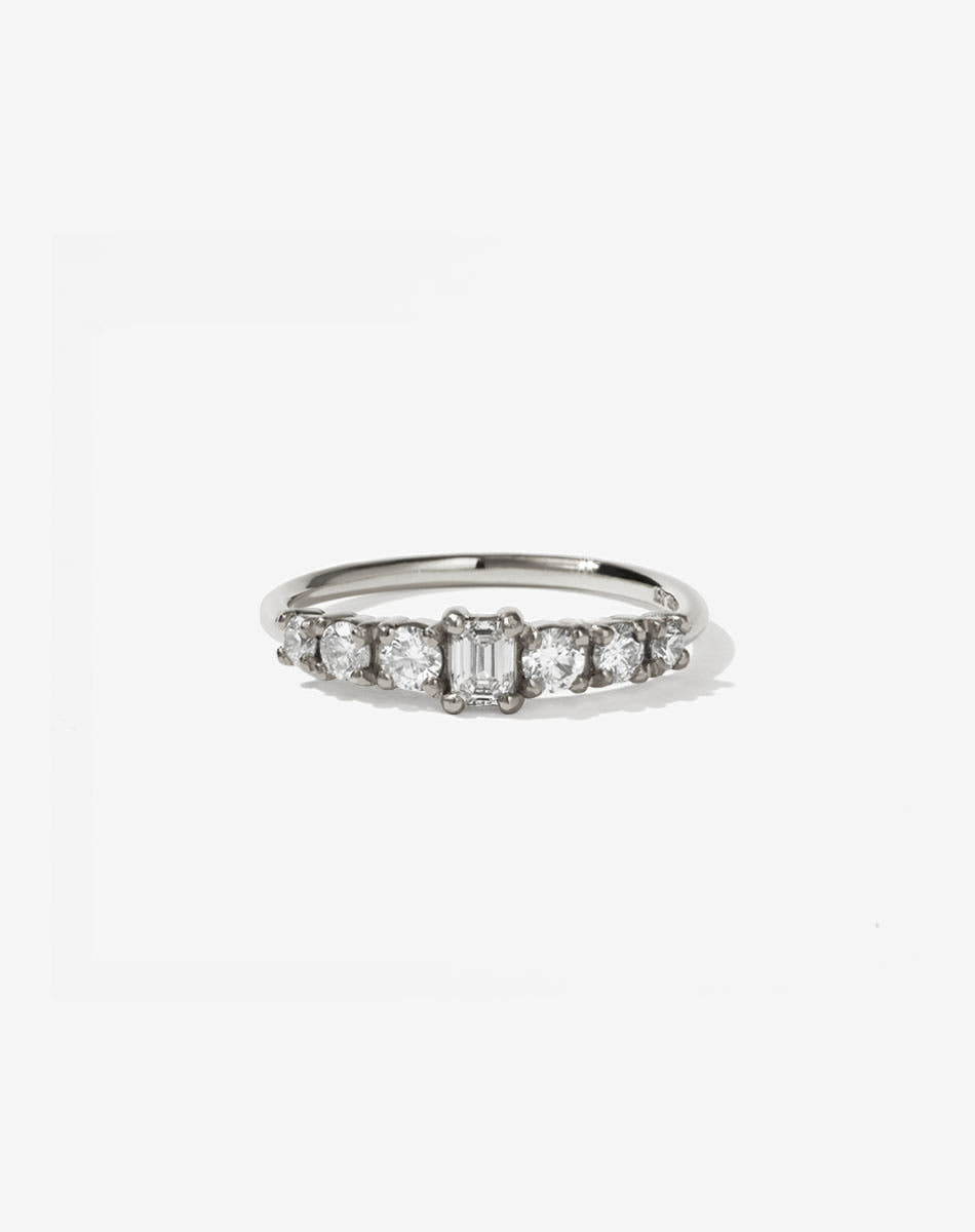 Meadowlark Jewellery’s beautiful Amelie Engagement Ring in 9ct White Gold, claw set with 0.70ct emerald cut and round brilliant cut white diamonds atop a fine round band. A low set, petite seven stone engagement ring this Ceremonial design made to order in New Zealand.