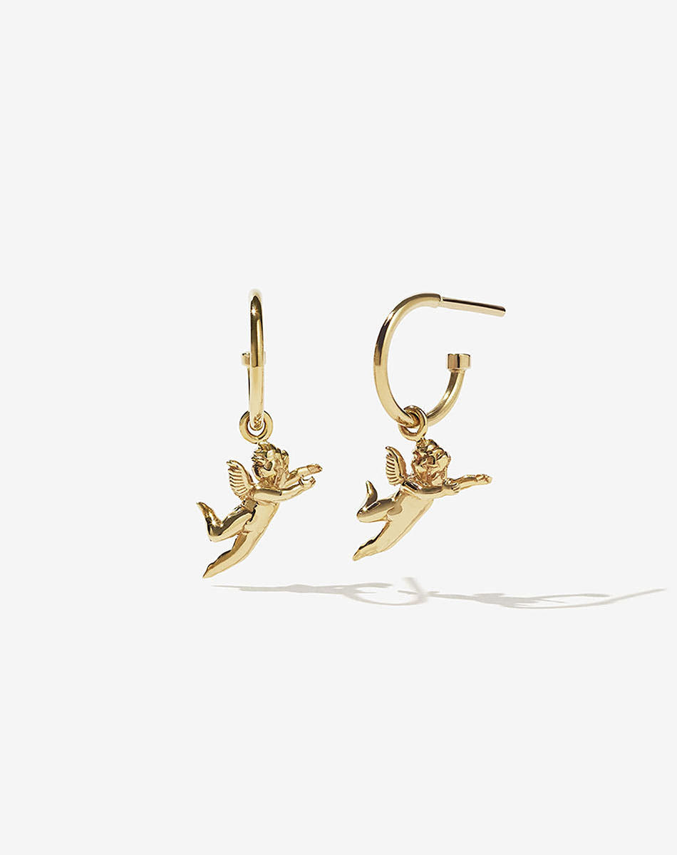 A pair of gold-plated hoop earrings with cherub charms attached