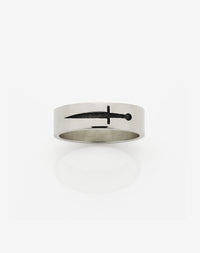 A 9ct white gold band ring with an etched dagger design, oxidised finish.