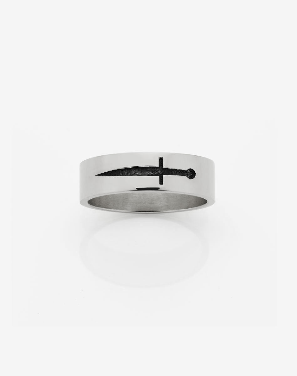 A silver band ring with an etched dagger design on the top surface.