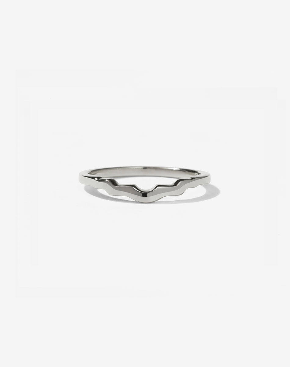 A wedding ring with stepped curves to fit with an engagement ring in 14ct white gold