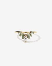 Meadowlark Jewellery’s vintage inspired Etta Engagement Ring in 9ct Yellow Gold, claw set with a pear cut white diamond centre stone, six baguette cut green sapphires, accented on one side with a round brilliant cut white diamond. Fully traceable and ethically sourced blue and green sapphires from Queensland, Australia. Atop a fine square band. A Ceremonial design made to order in New Zealand. Wear alone or as a wedding band with a solitaire engagement ring.