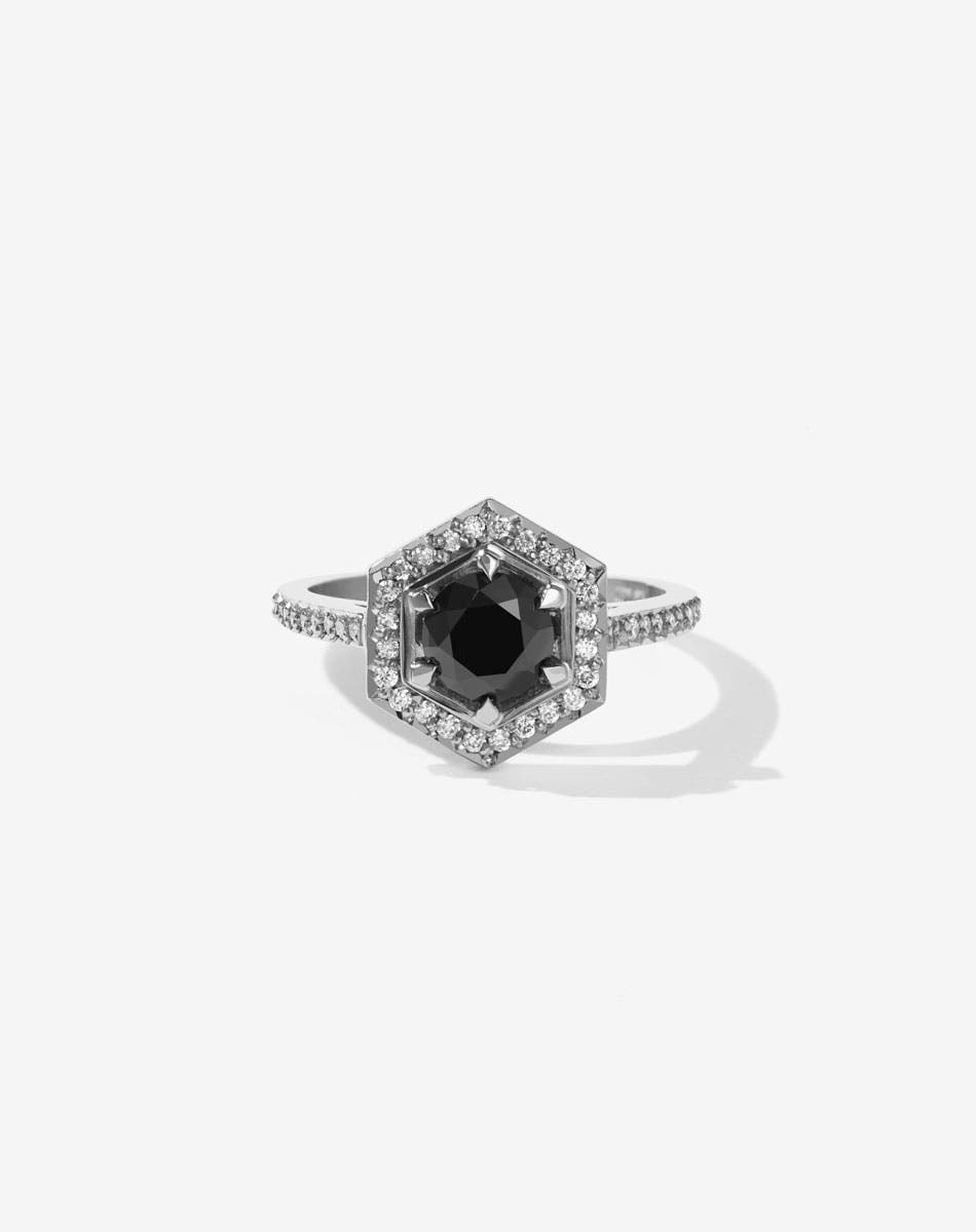 Meadowlark Jewellery’s iconic Hex Engagement Ring in Platinum, claw set with 1.08ct round brilliant cut black diamond centre stone, surrounded by a hexagon halo of pave set white diamonds. Finished with a fine square band, diamond pave set halfway. One of our most beloved and modern Ceremonial designs, made to order in New Zealand. Pair with our bestseller, the Diamond Eternity Band.
