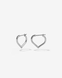 A pair of heart shaped sterling silver hoop earrings.