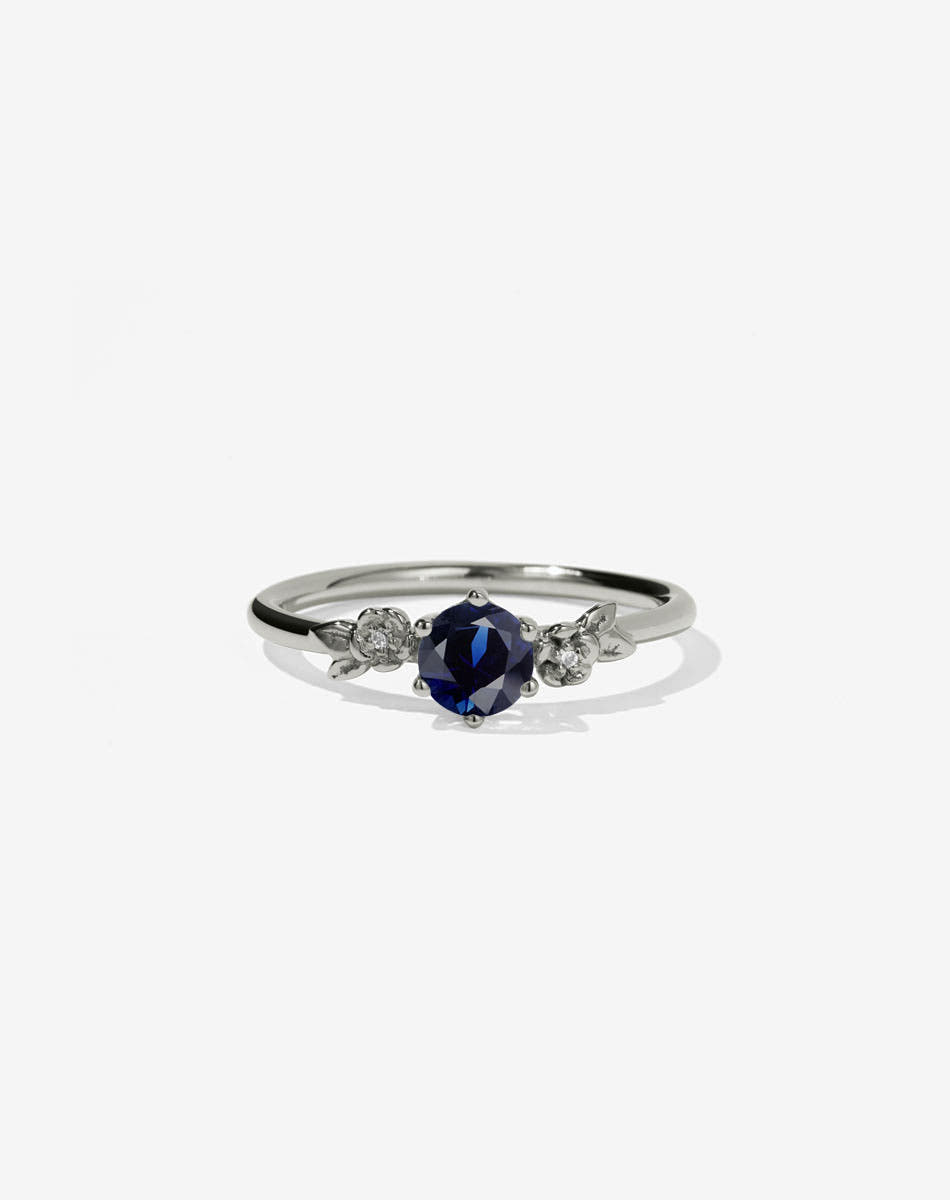 Floral Engagement Ring in white Gold with blue sapphire.