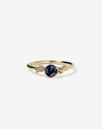 Floral Engagement Ring in yellow Gold with blue sapphire.
