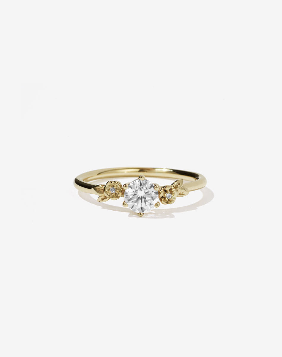 Floral Engagement Ring in yellow Gold with white diamond.