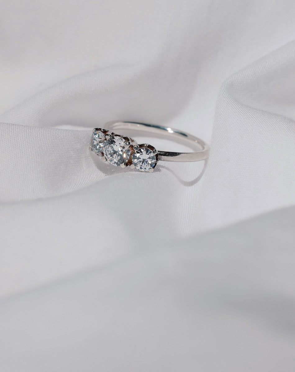A classic three stone engagement ring in white gold with diamonds.