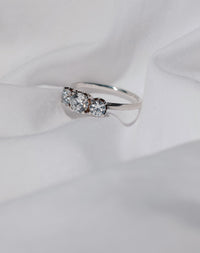 A classic three stone engagement ring in white gold with diamonds.