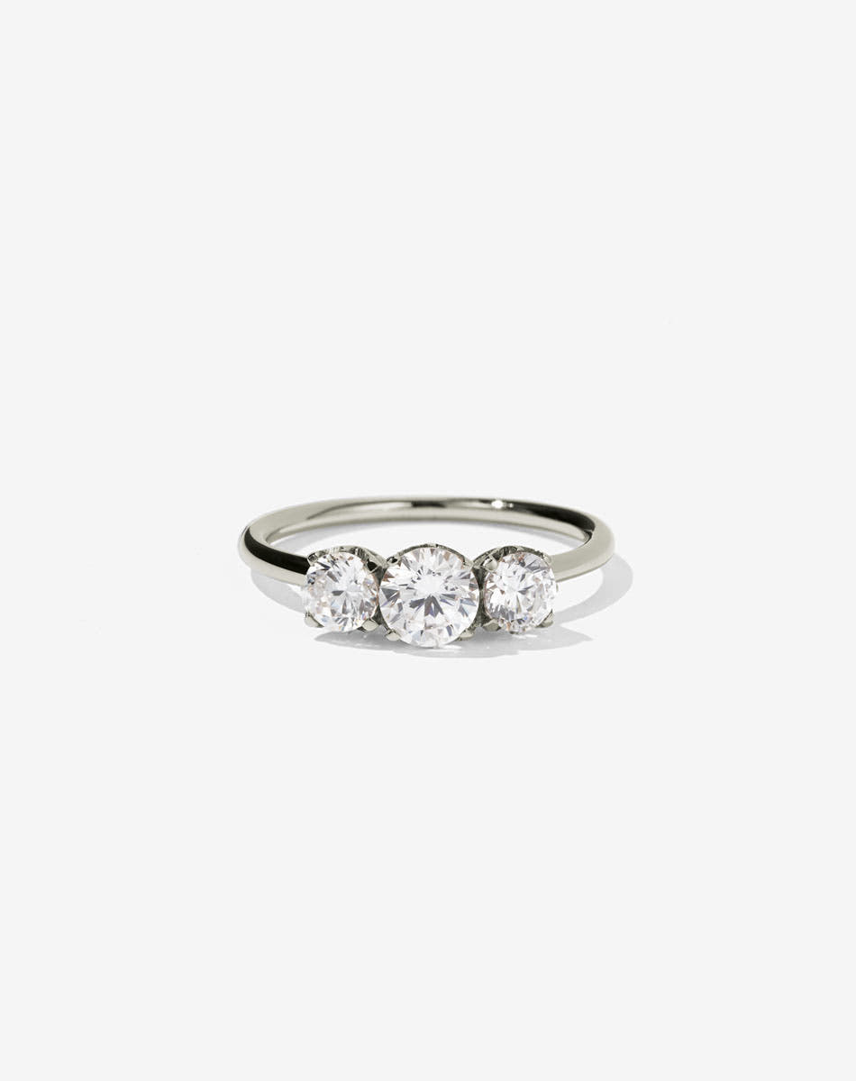 A classic three stone engagement ring in white gold with diamonds.