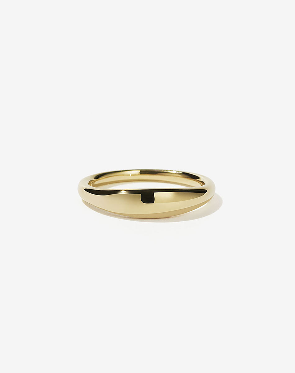 A simple, elegant gold ring with a curved design