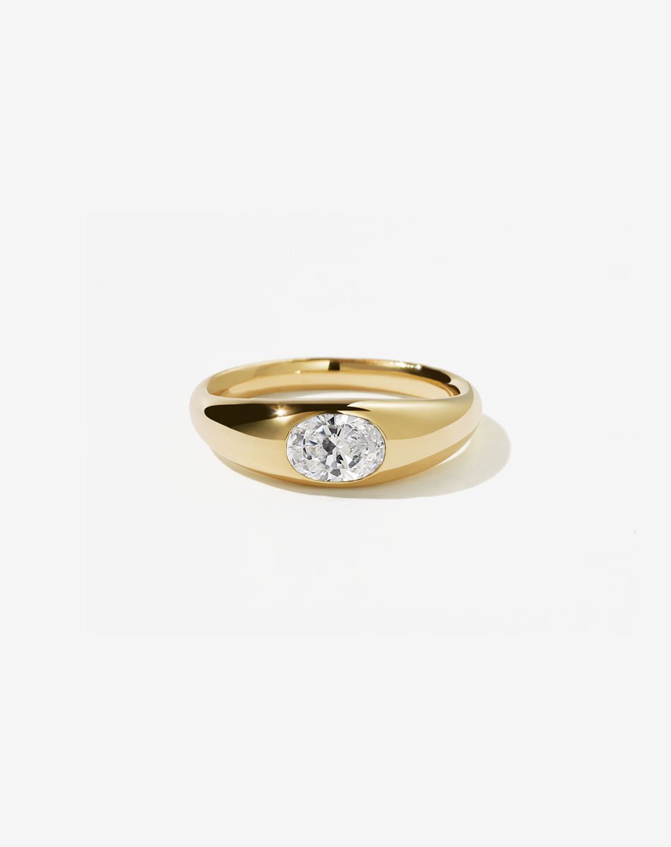 Meadowlark Jewellery&rsquo;s minimalist 0.75ct Claude Engagement Ring in 18ct Yellow Gold, swiss set with an oval cut white diamond. A simple &amp; timeless Ceremonial design made to order in New Zealand. Pair with the Claude Band.