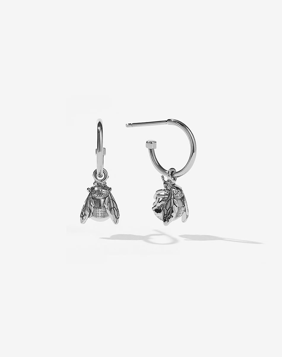 Meadowlark Jewellery's favourite, life giving Bee Signature Hoop Earrings in Sterling Silver. A symbol of birth &amp; rebirth, diligence, resilience and community. Celebrate the beginning of a new season in your life's chapter. Hung from classic signature hoop earrings. From the Charms collection.