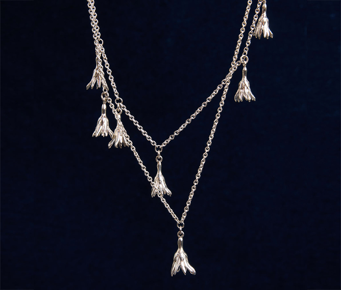 Meadowlark Jewellery&rsquo;s Magda Five and Two Charm Necklace in Sterling Silver. Five delicate, bell-shaped flower charms suspended from a fine diamond curb chain. A poetic celebration of growth, transformation, and the eternal rhythm of nature. A statement of quiet strength and beauty.